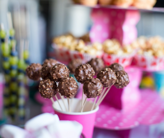 Chocolate cakepops on holiday dessert table at kid birthday party