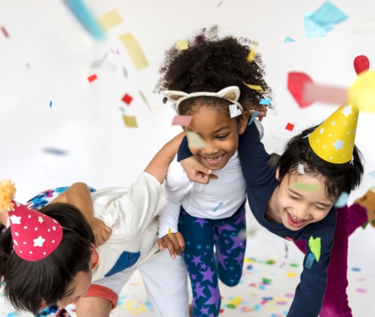 Group of kids celebrate party fun together